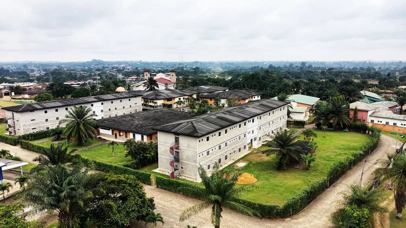 Aerial view of the buildings and green spaces of the UIL-BJ campus